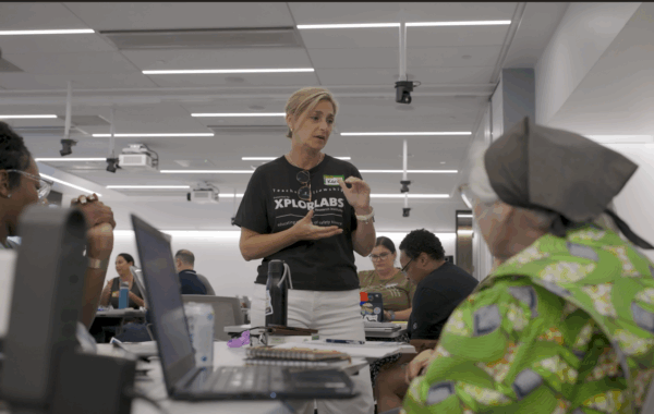 Kara Reeder engaged in conversation with other Xplorlabs Educator Fellows