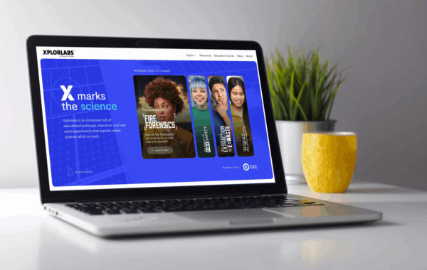 an image of a laptop on a desk, with the Xplorlabs website pulled up on the screen